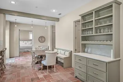 a kitchen and dining room with a table and chairs at Luxury Rosemary 4BR Villa with Private Pool in Rosemary Beach