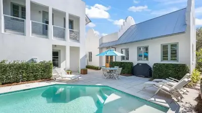 a backyard with a swimming pool and a house at Luxury Rosemary 4BR Villa with Private Pool in Rosemary Beach