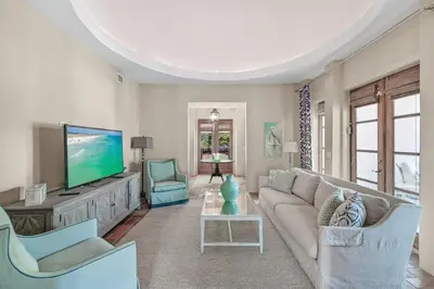 a living room with a couch and a flat screen tv at Luxury Rosemary 4BR Villa with Private Pool in Rosemary Beach