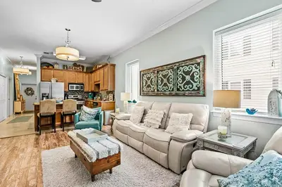 a living room with a couch and a table at Paradise 2205 in Santa Rosa Beach