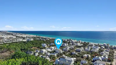 an aerial view of a city with a blue street sign at Anchors Aweigh in Seacrest