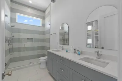 a bathroom with a sink and a tub and a toilet at Anchors Aweigh in Seacrest