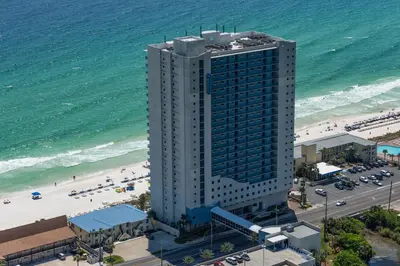 an aerial view of a tall building next to the beach at Sterling Breeze 307A by Emerald Coast Retreats in Panama City Beach