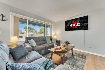 a living room with a couch and a table at 3 Blocks to Bay Boat Parking Renovated 3 Bd in Lynn Haven