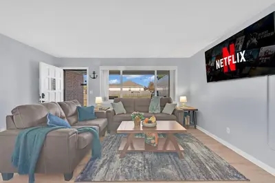a living room with a couch and a table at 3 Blocks to Bay Boat Parking Renovated 3 Bd in Lynn Haven