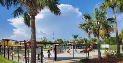 a playground with palm trees in a park at 3 Blocks to Bay Boat Parking Renovated 3 Bd in Lynn Haven