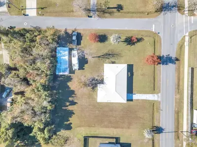 an aerial view of a yard with a house at 3 Blocks to Bay Boat Parking Renovated 3 Bd in Lynn Haven