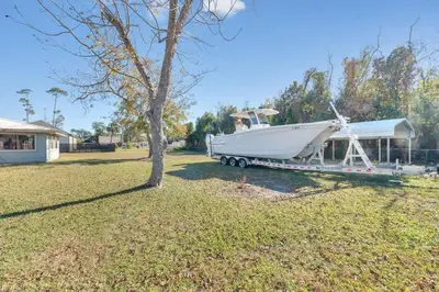 a boat on a trailer hooked up to a house at 3 Blocks to Bay Boat Parking Renovated 3 Bd in Lynn Haven