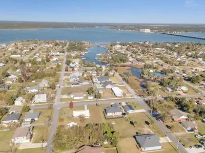 an aerial view of a town next to a body of water at 3 Blocks to Bay Boat Parking Renovated 3 Bd in Lynn Haven