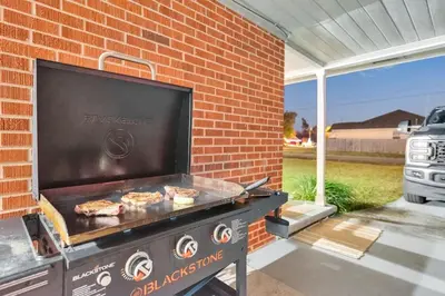 a grill with some food on top of it at 3 Blocks to Bay Boat Parking Renovated 3 Bd in Lynn Haven