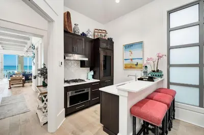 a kitchen with a white counter and a sink at Gulf Royale 30A in Inlet Beach