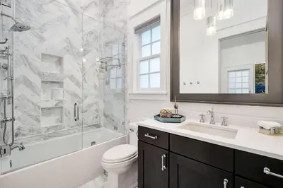a bathroom with a sink toilet and a shower at Gulf Royale 30A in Inlet Beach