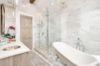 a bathroom with a tub and a shower and a sink at Gulf Royale 30A in Inlet Beach
