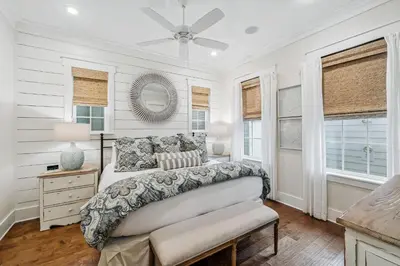 a bedroom with a bed and a ceiling fan at Beach Heaven in Inlet Beach