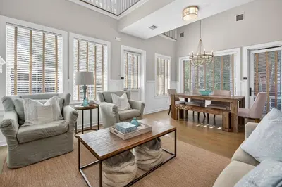 a living room with couches and a table at 231 Saltbox Lane - Near Beach Home with Community Pool in Watersound in Watersound Beach