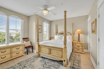 a bedroom with a bed and a ceiling fan at 30A Monterey B201 - Gulf Front Condo Near Alys Beach in Seacrest
