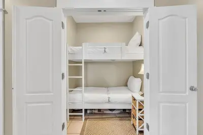 a small room with bunk beds in it at 30A Monterey B201 - Gulf Front Condo Near Alys Beach in Seacrest