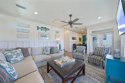 a living room with a couch and chairs and a tv at Arrabella - Gulf Views with Deck & Community Pool in Santa Rosa Beach