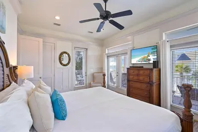 a bedroom with a bed and a ceiling fan at Arrabella - Gulf Views with Deck & Community Pool in Santa Rosa Beach