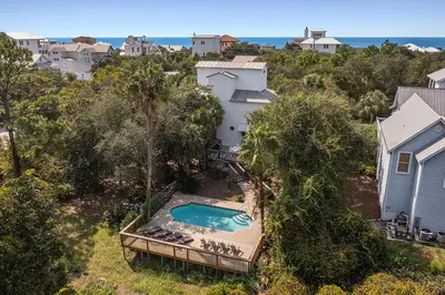 an aerial view of a house and a swimming pool at Beach Baby - Secluded Home with Private Pool Area & Deck in Santa Rosa Beach