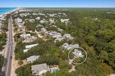 an aerial view of a house with a circle at Beach Baby - Secluded Home with Private Pool Area & Deck in Santa Rosa Beach