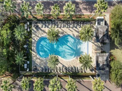 an overhead view of a swimming pool with palm trees at Cassine Gardens #270 - The Getaway in Santa Rosa Beach