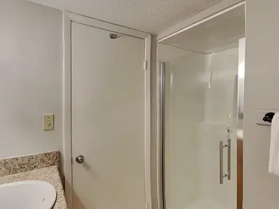 a bathroom with a shower and a toilet at Dunes of Panama #D705 in Panama City Beach