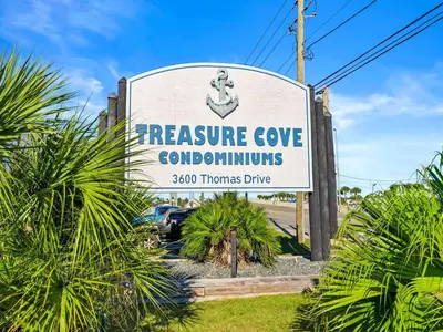 a sign for a resource cove condominiums at Treasure Cove #D308 - Paradise City in Panama City Beach