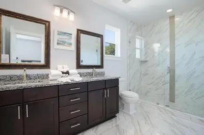 a bathroom with a sink and a toilet and a shower at Seacrest Paradise Spacious 4 bedroom retreat in Inlet Beach, perfect for 13 guests in Inlet Beach