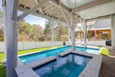 an outdoor swimming pool with a pavilion at Seacrest Paradise Spacious 4 bedroom retreat in Inlet Beach, perfect for 13 guests in Inlet Beach