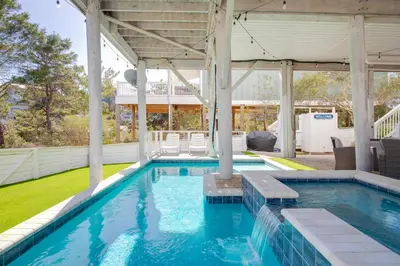 a swimming pool in a house with a pavilion at Seacrest Paradise Spacious 4 bedroom retreat in Inlet Beach, perfect for 13 guests in Inlet Beach