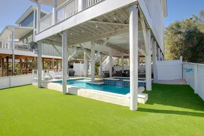 a large house with a swimming pool in a yard at Seacrest Paradise Spacious 4 bedroom retreat in Inlet Beach, perfect for 13 guests in Inlet Beach