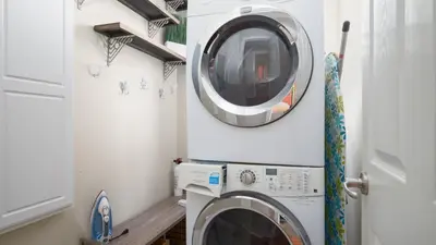 a washer and dryer in a laundry room at Experience luxury at Doctor in Inlet Beach