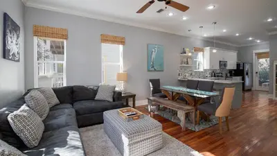 a living room with a couch and a table at Experience luxury at Doctor in Inlet Beach