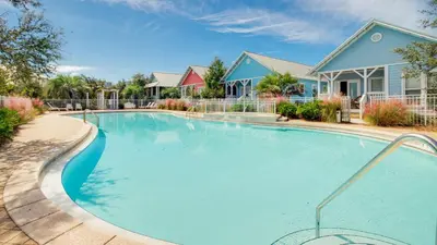 a large swimming pool in front of a house at Experience luxury at Doctor in Inlet Beach