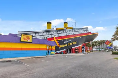 a large cruise ship parked in a parking lot at Billie Jean’s Bungalow! Cozy Edgewater Condo w/ Resort Amenities, Sleeps 6 in Panama City Beach