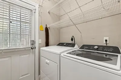 a kitchen with a stove and a dishwasher at Sunset Cove: Charming 3BR/3BA Beach House Sleeps 8 with Sunsets & Serenity in Panama City Beach
