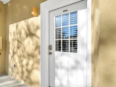 a white door with a window in a room at Heron's Watch Way 1102 in Santa Rosa Beach