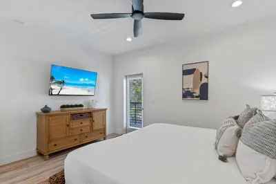 a bedroom with a bed and a ceiling fan at The Gathering Place by Travel Life Vacations in Santa Rosa Beach