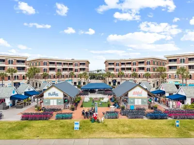 an outdoor market in front of a large building at The Magnolia by 30A Escapes in Rosemary Beach