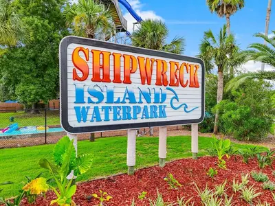 a sign for a swimming island water park at Charming house near the beach in Panama City Beach