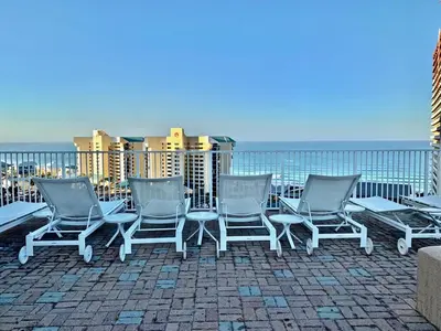a group of chairs sitting on top of a roof at Beach-Ready Resort Condo! Pools & Walk to Beach by Dolce Vita Getaways in Panama City Beach