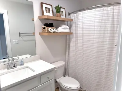a bathroom with a toilet and a sink and a shower at Coastal Retreat, 1 Mile to Beach, Pool & Golf Cart in Panama City Beach