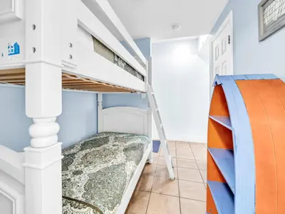 a bunk bed in a bedroom with a bunk bed in a room at Majestic Beach Towers 1-1906 in Panama City Beach