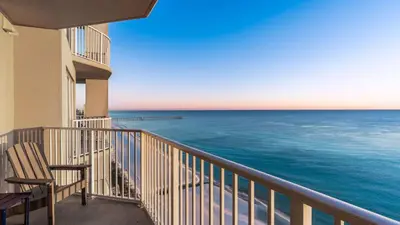 a balcony with a view of the ocean at Beachfront Tidewater Resort Condo w Pools Hot Tubs Pier Park Nearby Tidewater Beach by AvantStay in Panama City Beach