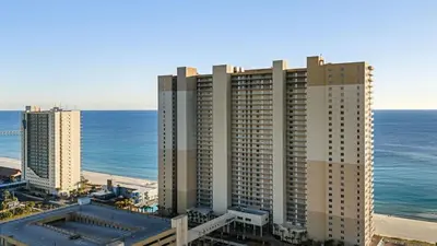 an aerial view of a large building at the beach at Beachfront Tidewater Resort Condo w Pools Hot Tubs Pier Park Nearby Tidewater Beach by AvantStay in Panama City Beach