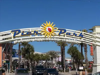a sign over a street in a city with cars at Seychelles 602 by Emerald Coast Retreats in Panama City Beach