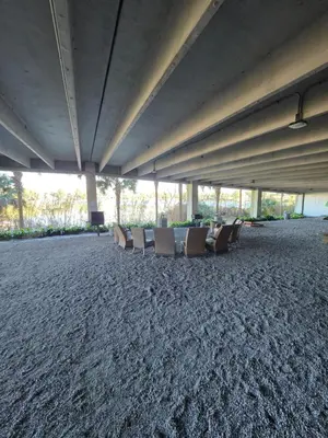 a group of chairs sitting on the floor of a building at Beautiful gulf front condo with grill on balcony in Panama City Beach