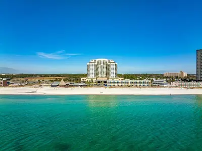 a view of a beach with buildings and the ocean at Origin 0525 - Studio King - Peaceful Nature View in Panama City Beach