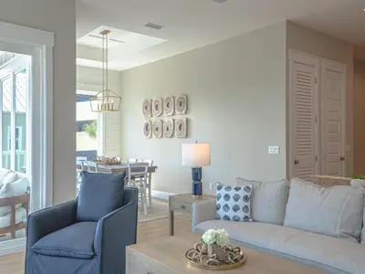 a living room with a couch and a table at Coastal Breeze in Panama City Beach